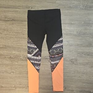 Black and Patterned Leggings with Orange Accents